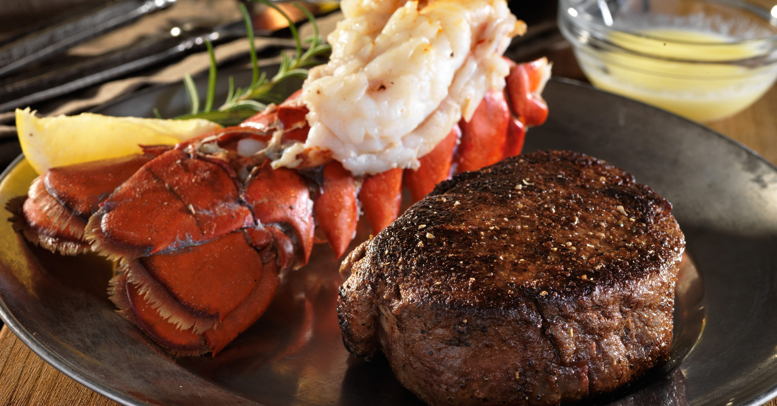 Cousin's Romantic Dinner for Two Dinner plate with beef medallion, lobster tail and mash potatoes.
