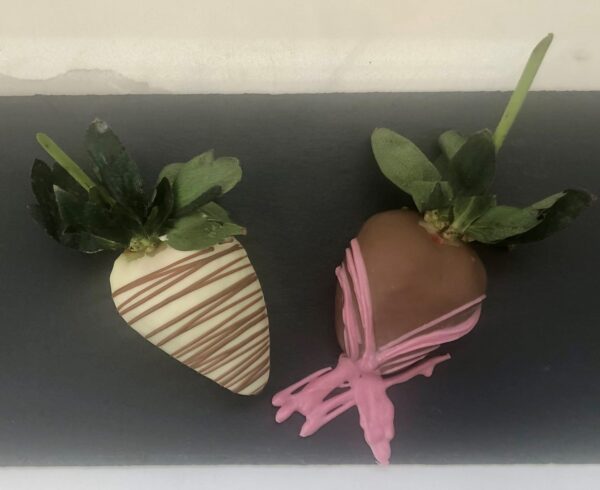 Photo of chocolate-covered strawberries on long stem