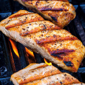 Grilled salmon steaks on the grill.