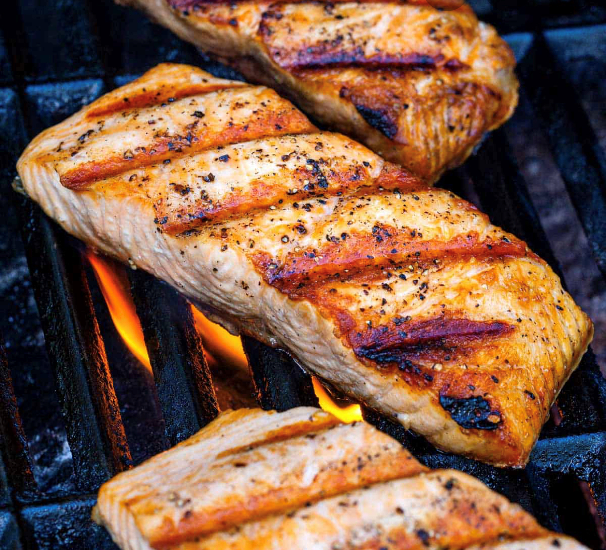 Actual item may vary from image shown Grilled salmon steaks on the grill.